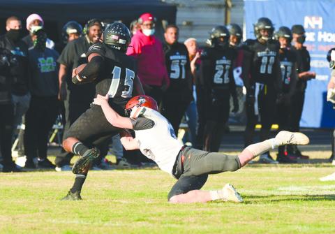 Habersham Central’s Garrett Heaton lunges to take down Shiloh quarterback Antonio Meeks during Saturday’s game. TOM ASKEW/Staff