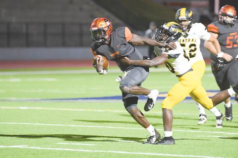 Habersham Central’s Joshua Pickett does a Heisman stiffarm to bypass a Central  Gwinnett tackler on Tuesday night. TOM ASKEW/Special