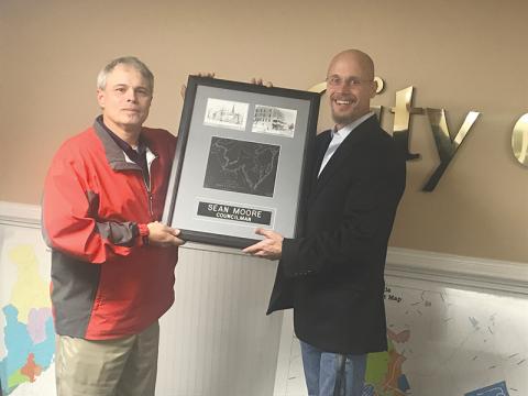 Demorest Mayor Rick Austin (right) presented departing Councilman Sean Moore with a plaque commemorating his service at Tuesday’s City Council meeting.