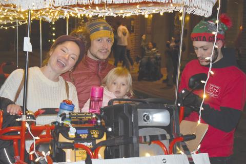 Jessica and Chris Gneiding took their little ones Anneliese (shown) and Lucas on the pedal cart at the Downtown Christmas event in Cornelia on Saturday.