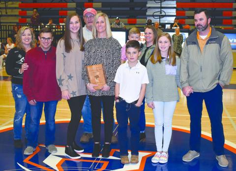 Christy Keef was joined Friday night during her induction by (front row, from left) Tammy Harris; children Carlin Fricks, Camryn Fricks, Kyler Keef and Katie Keef; and husband Dan Keef. In back are (from left) Alex Harris, Garrison Stamey and Valerie Stamey.