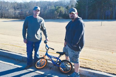 Jarrod Seabolt (left) and Mikel Bramblett have provided 26 repaired bicycles to children this Christmas as part of Drug Court’s requirements to give back to the community, but they plan to keep giving beyond completion of the program.