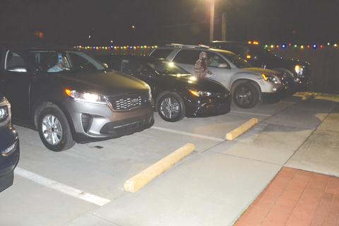 Mt. Airy’s town council members stayed in their cars Monday night and voted by reaching out the window.