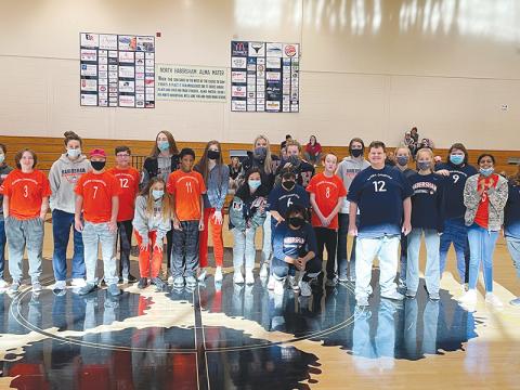 Members of the Raider Champions League take a photo with volunteers from the Lady Raiders basketball team. The league was started by Judy Thompson, a special education teacher at North Habersham Middle School, with the goal of allowing participants to have fun and participate equally in the game of basketball. JUDY THOMPSON/Submitted