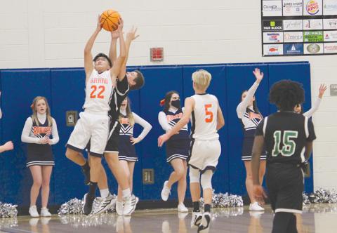 Brody Bantaum skies for a rebound in the seventh grade championship game. The Raiders knocked off Franklin County 43-36 to win the title. 