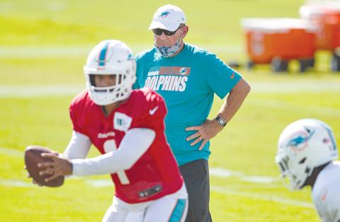 Chan Gailey of Clarkesville coaches Tua Tagovailoa with the Miami Dolphins earlier this season. Gailey left the Dolphins Jan. 6 ending what could be his last coaching stop. ALLEN EYESTONE/Courtesy of Palm Beach Post