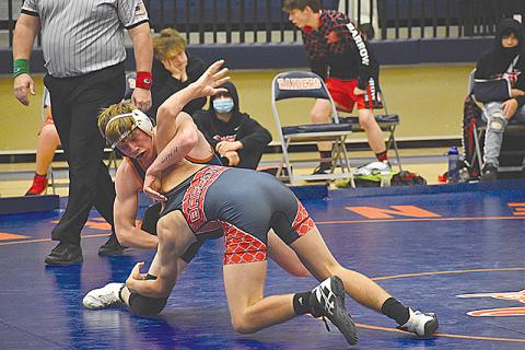 Habersham Central’s Eli Pilgrim prepares to flip his Winder-Barrow opponent on the way to a pinfall victory during Saturday’s area duals.