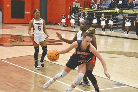 Habersham  Central’s Taylor Wade drives inside against a Stephens County defender during Tuesday night’s game in Toccoa.