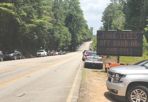 Heavy crowds at Panther Creek Park often cause scenes like this, with visitors parking alongside the edge of the road which can create safety hazards.