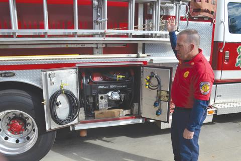 Demorest Fire Chief Ken Ranalli explains the process his staff has to go through to get additional lighting at an emergency scene, including pulling a generator stored in the department’s pump truck. The truck has been in service in Demorest for 25 years.