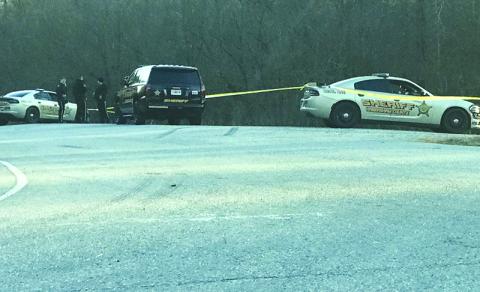 Habersham County Sheriff’s deputies gather near the White County line on Highway 115 Monday afternoon to investigate a shooting.