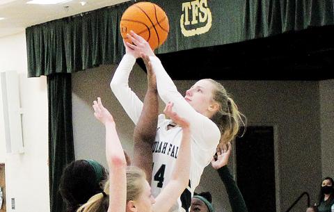 Macy Murdock finishes a layup over three Lady Wolves defenders.  Murdock will be one of the returning players looked to for leadership next season with the Lady Indians losing three senior starters.