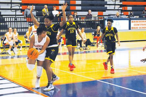 Habersham Central’s Nykerriah Brown works around a zone defense during Friday night’s win over Central Gwinnett.