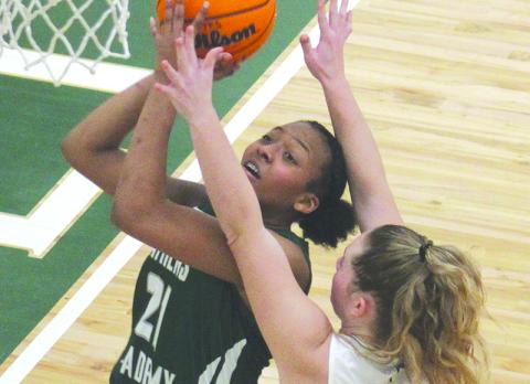 The Lady Indians’ Abby Carlan defends Athens Academy’s India Sheats under the hoop. ANDY DIFFENDIRFER/Clayton Tribune