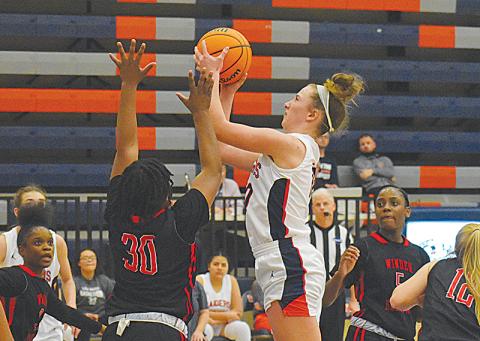 Habersham Central’s Taylor Wade looks to score inside against Winder-Barrow on Tuesday night.