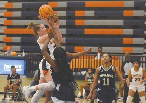 Habersham Centra's Taylor Wade drives hard to the hoop against Douglas County. CODY ROGERS/Staff