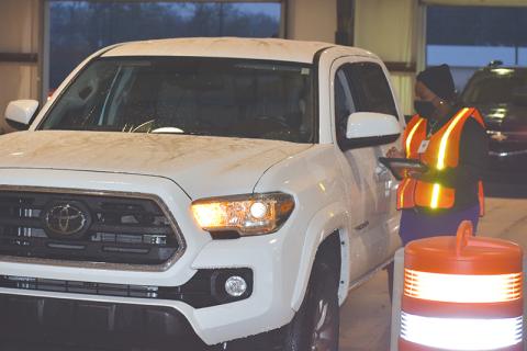 The first car gets checked in at the Habersham County mass vaccination site Monday morning in Clarkesville.