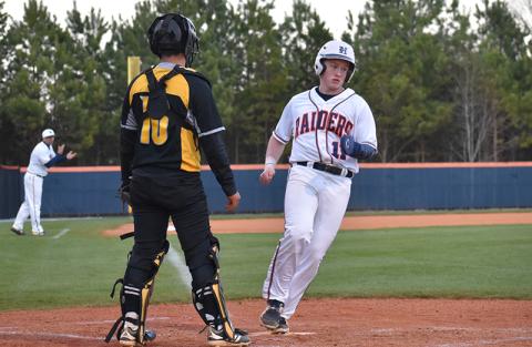 Habersham Central outfielder Austin Jones scores in the second inning on a sacrifice fly from Logan Bogue for one of the 16 runs the Raiders scored Monday night.