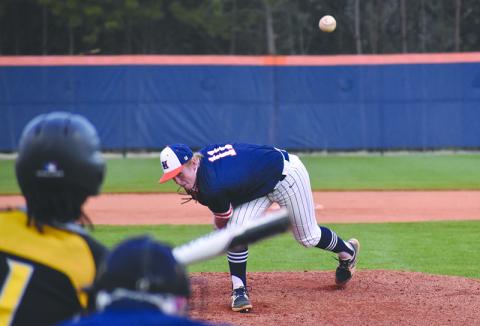 Austin Jones (11) delivers a pitch to Central Gwinnett’s Justin Johnson during a recent home game. In game one against Buford, Jones held the Wolves’ bats at bay to keep the Raiders in the game heading into the sixth inning. 