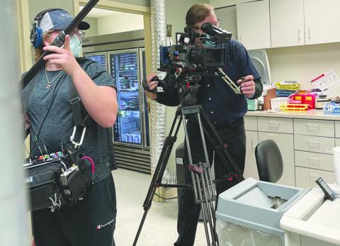 Habersham Central senior Carter Marsengill (left) works with the crew filming Friday at Habersham Medical Center for a feature story on 60 Minutes-Plus.