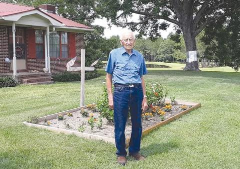 Sandy Turner’s father, James Thompson of Wrightsville, passed away due to COVID-19  in January.  At his funeral, someone used an old cross as a flower arrangement. She thought it was an appropriate gesture. 