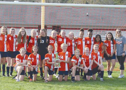 The Lady Raiders soccer team celebrates their middle school championship. Front row (from left) are Emmie Kyle, Meg Labarbera, Eden Turner, Kaitlyn Fuller, Megan Eash, Jillian Tedder, and Zoe Sosesbee. Back row are Jalyn Purdy, Madie Wilbanks, Abigail Mize, Maddox Carroll, Kelsie Campbell, Belle Cummings, Hannah Vidrine, Jazlyn Burke, Kenzie King, Emyrie Combs, Jacqueline Ramirez, Yamilex Ortero, and coach Melissa Carroll.