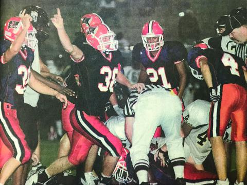 Habersham Central’s Marty Patterson (38) celebrates along with teammates after a big stop during a 2006 game.