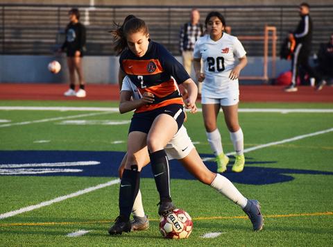 Habersham Central’s Ryalie Acker battles for position against a defender during a home game earlier this season against Winder-Barrow.