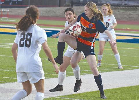 Habersham Central’s Sarah Clark juggles the ball to gain possession during Tuesday’s win over Winder-Barrow.