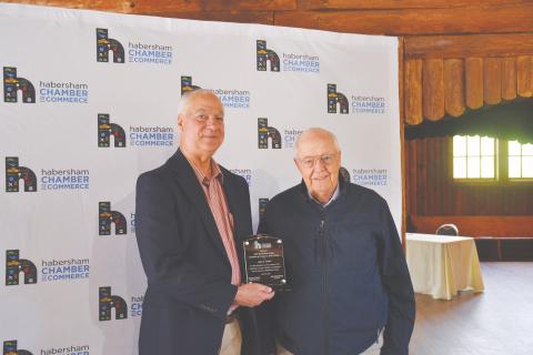 Habersham County Chamber of Commerce Hall of Fame inductee John Foster (right) is presented his award by Joey Duncan. 