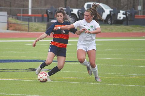 Abigail Deleon (14) battles Buford’s Emma Chaffee in a recent match. The Lady Raiders secured a playoff berth last Thursday with a 2-0 road victory over Winder-Barrow.