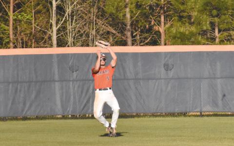 Azzi Cervantes makes a catch in center field during the Raider’s last home game against Lanier. Cervantes had two RBI for HCHS Wednesday night. ISAIAH SMITH/Staff 