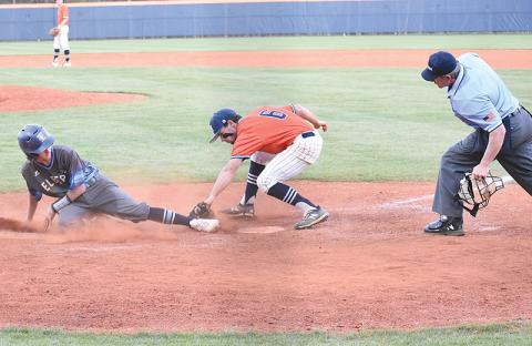 Habersham Central’s Azzi Cervantes puts down a tag on an Elbert County runner looking to score on a wild pitch in the  Raiders 11-3 loss to Elbert County on Monday night.