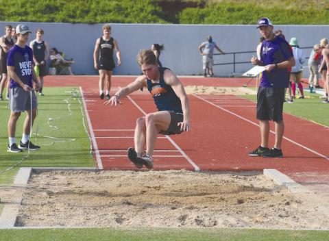 Garrett Heaton takes one of his attempts in the long jump at The Battle of the Blue Ridge at HCHS. Heaton won the event last Friday at the Mt. Yonah Invite.