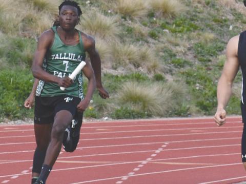 Tallulah Falls’ Simeon Respress runs a relay at the Battle of Blue Ridge last month. Respress also took second in the long jump at the Georgia Spring Break Showdown. ISAIAH SMITH/Staff
