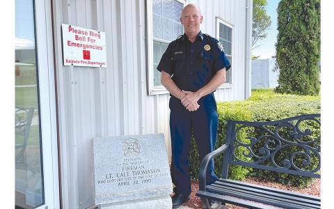 Baldwin Fire Chief Joe Roy has been with the department for 35 years. He is shown  beside the memorial for fallen firefighter Cale Thomason. BRIAN WELLMEIER/Staff 
