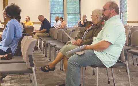 Lifelong Habersham County resident Ernie Garrett, far right, said on Tuesday he has done all he can to stop the erosion on his property from Camp Creek, but he can’t afford to keep taking matters into his own hands. CHAMIAN CRUZ/Staff