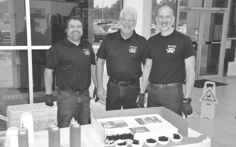 Hayes auto dealership of Baldwin celebrated its 50th anniversary Monday with a luncheon for its employees and invited guests. Shown cutting the cake are (from left) Matt Hayes, Terry Hayes and Chad Hayes. Hayes sells commercial and personal vehicles from eight different brands and is located on Highway 365 in Baldwin. MATTHEW OSBORNE/Staff 