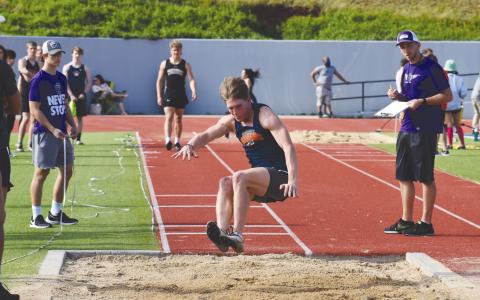 Garrett Heaton takes an attempt in the triple jump during a meet at HCHS. Heaton finished ninth in the event at the state meet last weekend, and he added a fourth-place finish in the 400 meter dash. ISAIAH SMITH/Staff 