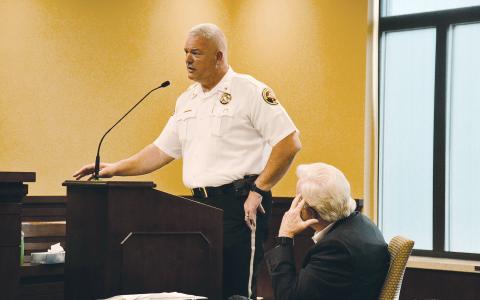 Habersham County Sheriff Joey Terrell speaks as County Manager Phil Sutton listens to his plea for immediate raises for his officers. MATTHEW OSBORNE/Staff