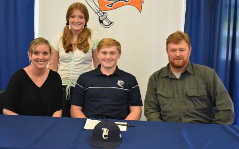 Austin Jones (center) committed to Toccoa Falls College. He was joined by his mother Grace Jones (left), father Darrell Jones (right) and sister Ashley (back).
