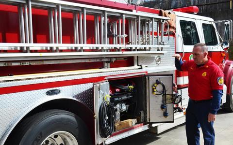 Demorest Fire Chief Ken Ranalli explains the features of his truck earlier this year.