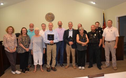 (Front left-right): Council members Roxie Barron, E. Lane Gresham, Mayor Barrie Aycock, Officers Larry Sheffield and Stanley Lovell, Municipal Court Clerk Elaine Waller, Officers Ryan Ledford and Daniel Clouatre. (Back row left-right): Council members Franklin Brown, Terry Gladden, Steven Ward, Police Chief Brad Barrett, and Officer Jamie Bowden. BRIAN WELLMEIER/Staff 