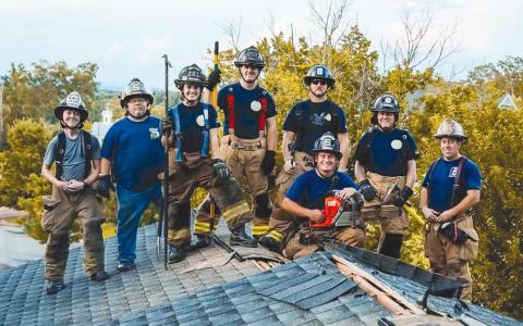 Firefighters from Demorest and Cornelia’s fire departments (from left) Daniel Purcell, Chris Falck, Angela Martin, Chris Bruce, Shane Bentley, Brian Smith, former Demorest Chief Ken Ranalli and Drake Meister (in front with saw) trained together last year. KEN RANALLI/Submitted