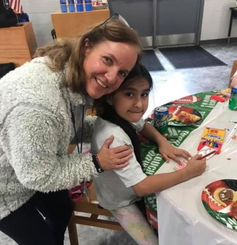 Former Hazel Grove Elementary School Principal Fran Blackburn celebrates Lily Contreras’ student achievement with a pizza party. FRAN BLACKBURN/Submitted