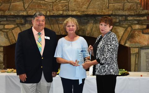 Georgia Municipal Association Member Services Consultant Stan Brown, left, and Director of Members Services Pam Helton, right, congratulate Cornelia City Clerk Janie Henderson, middle, for receiving the Lifetime Achievement Award. CHAMIAN CRUZ/Staff