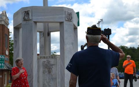Ray Durham salutes the KIA Memorial in Clarkesville along with Sandra White (left). BRIAN WELLMEIER/Staff
