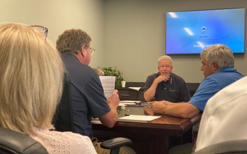 Habersham County Airport Commission board members Greg Caudell, Ken Schubring and D. Higgins discuss the possibility of hosting an airplane show at the airport next spring. CHAMIAN CRUZ/Staff