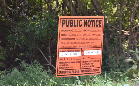Signs like these are put up when a public hearing is scheduled about a potential zoning change. MATTHEW OSBORNE/Staff 