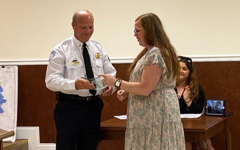 City Clerk Emily Woodmaster presents Fire Chief Joe Roy an award for 35 years of service. BRIAN WELLMEIER/Staff 